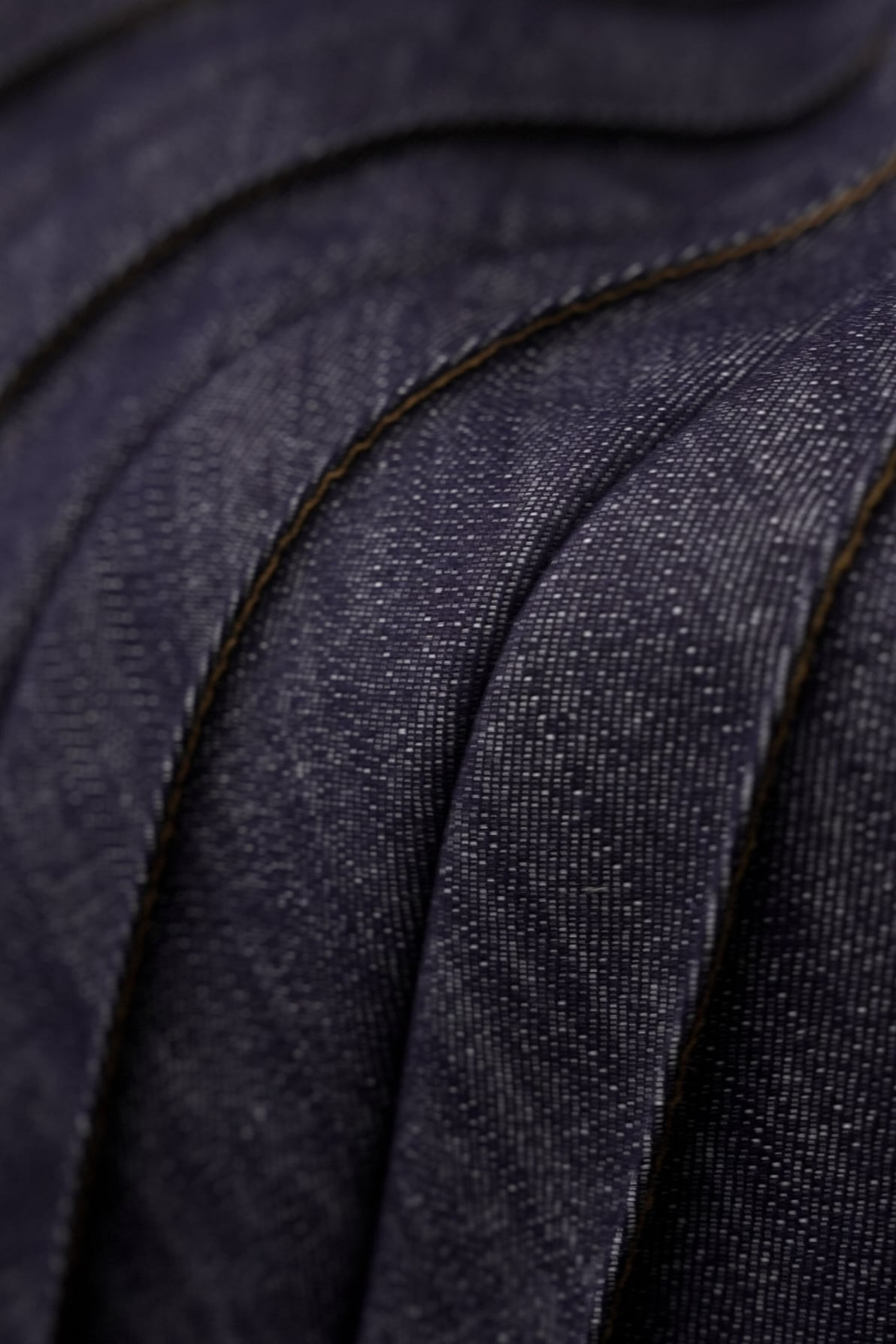 Pleated denim skirt close up photo