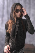 Woman wearing pleated chevron scarf around her head. 