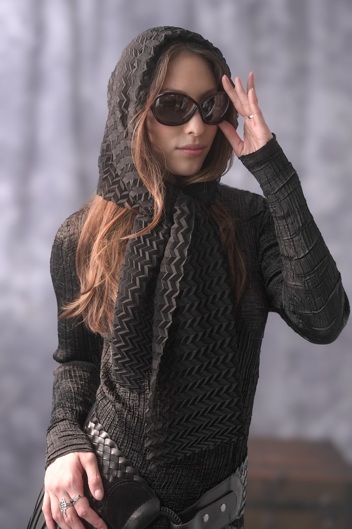 Woman wearing pleated chevron scarf around her head. 